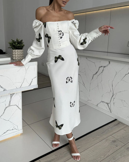Elegante jurk met vierkante hals en vlinderprint met visstaart